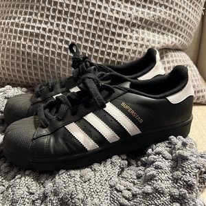 Black/white striped adidas superstars